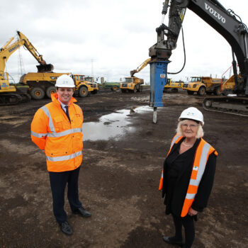 13 - Mayor Houchen with Cllr Lanigan in front of the heavy machinery used to remediate the land